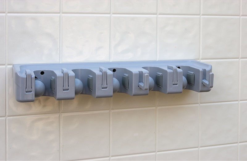 Carlisle 4073700 Roll 'N Grip Plus Wall Mount Lightweight Plastic Broom/Brush Holder 16-1/2"L x 5"W x 3-1/2"H - Light Blue