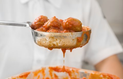 Vollrath 6432865 Jacob's Pride Color-Coded One-Piece Heavy-Duty Stainless Steel Perforated Round Spoodle Food Portioner with Orange Nylon Handle 8 oz.