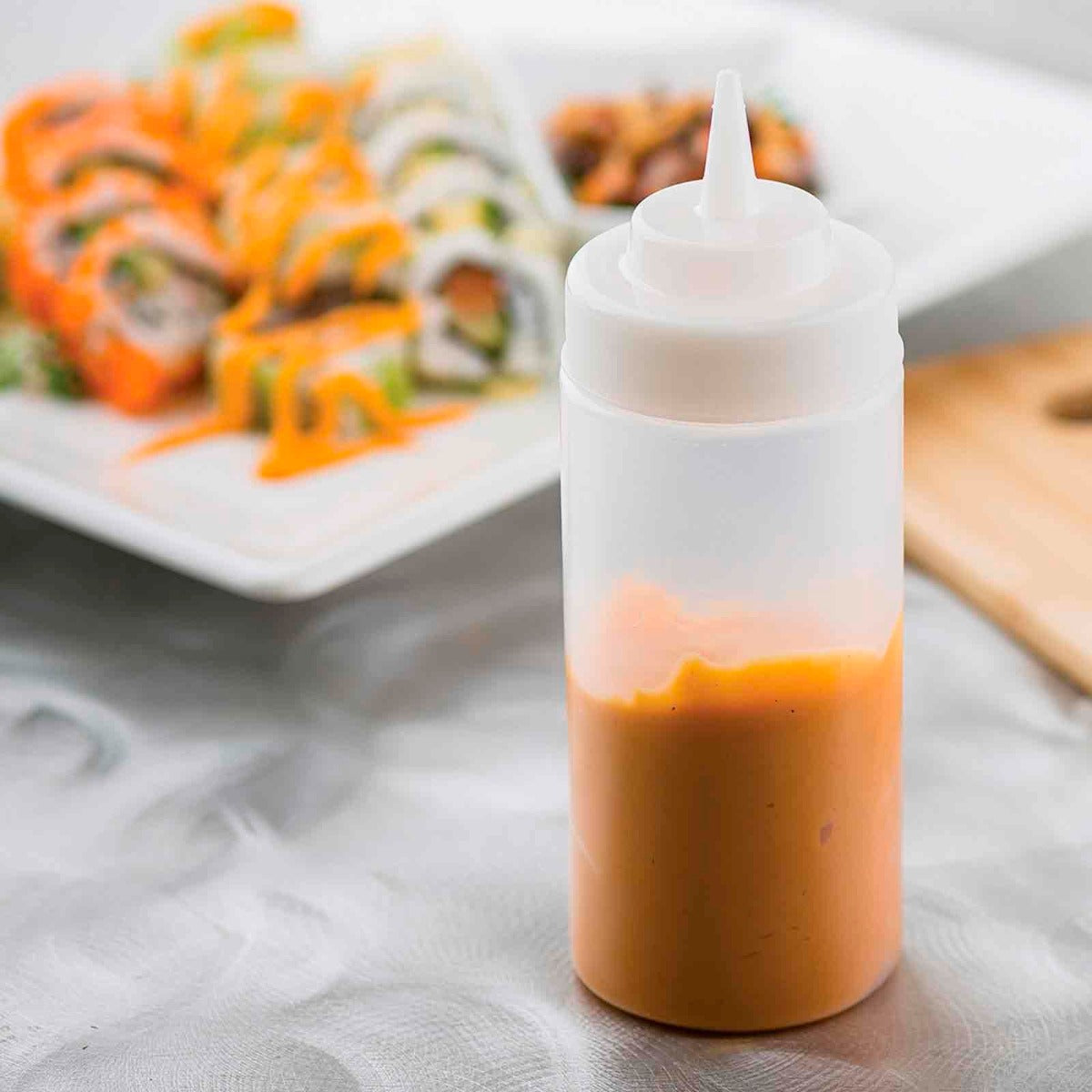 TableCraft 11663C Widemouth Polyethylene Squeeze Bottle with Natural Cone Tip and 63 mm Opening 16 oz. - Clear - 24/Case