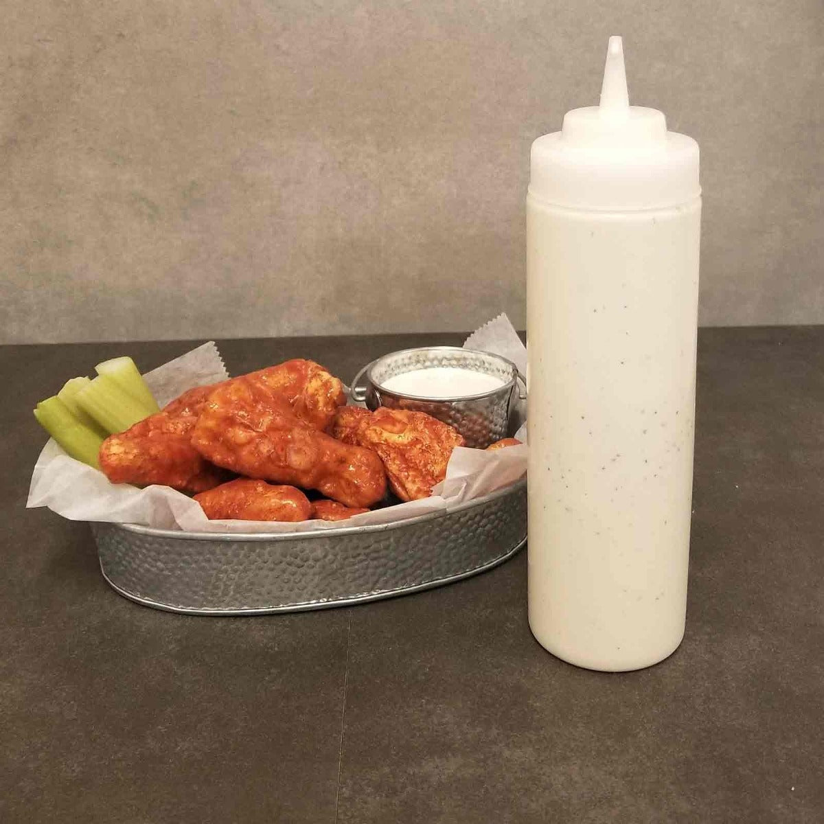 TableCraft 124C-1 Standard Polyethylene Squeeze Bottle with Natural Cone Tip Top and 38 mm Opening 24 oz. - Clear - 12/Case
