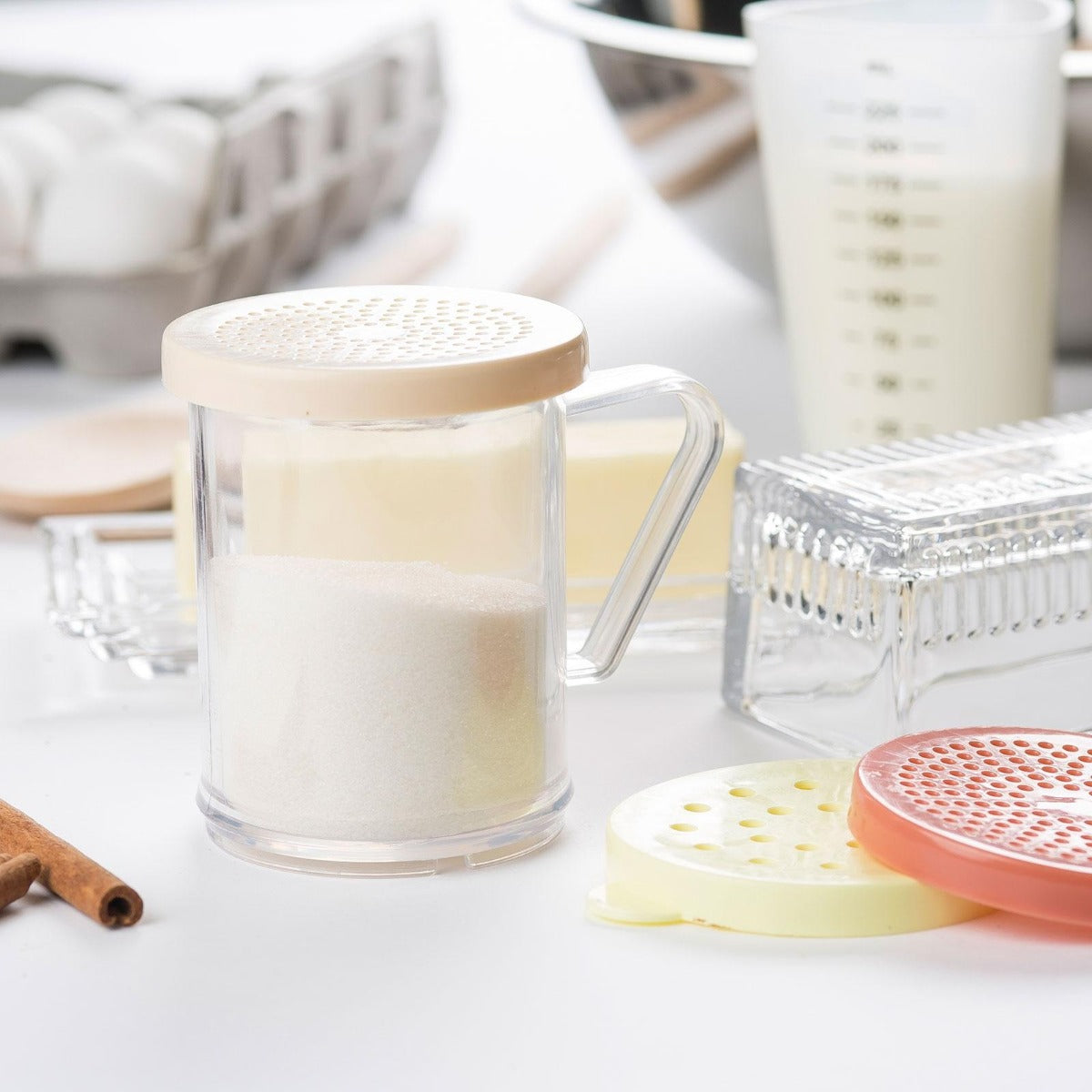 TableCraft 166A Plastic Dredge / Shaker with Handle and Beige Snap-Top "Salt & Pepper" Lid 10 oz. - Clear - 12/Case