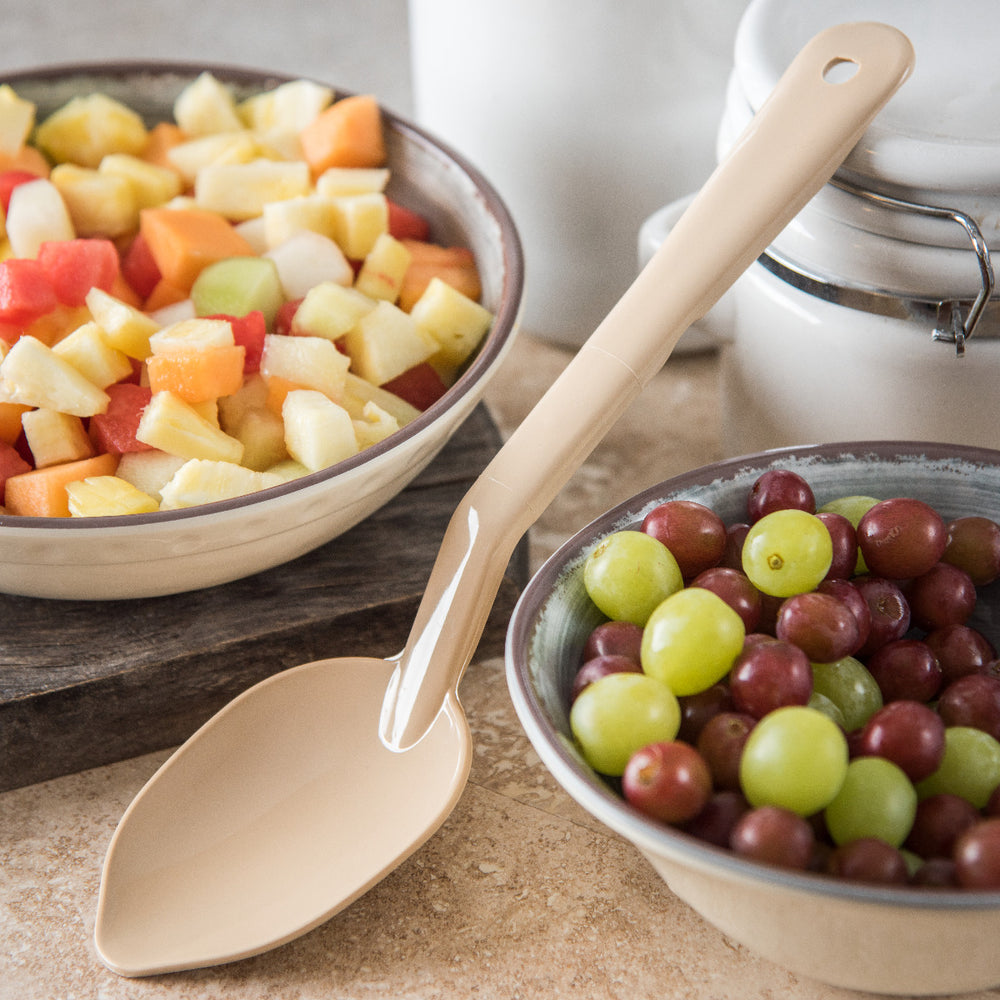 Carlisle 441006 One-Piece Plastic Solid Serving Spoon with Notched Handle 11" - Beige