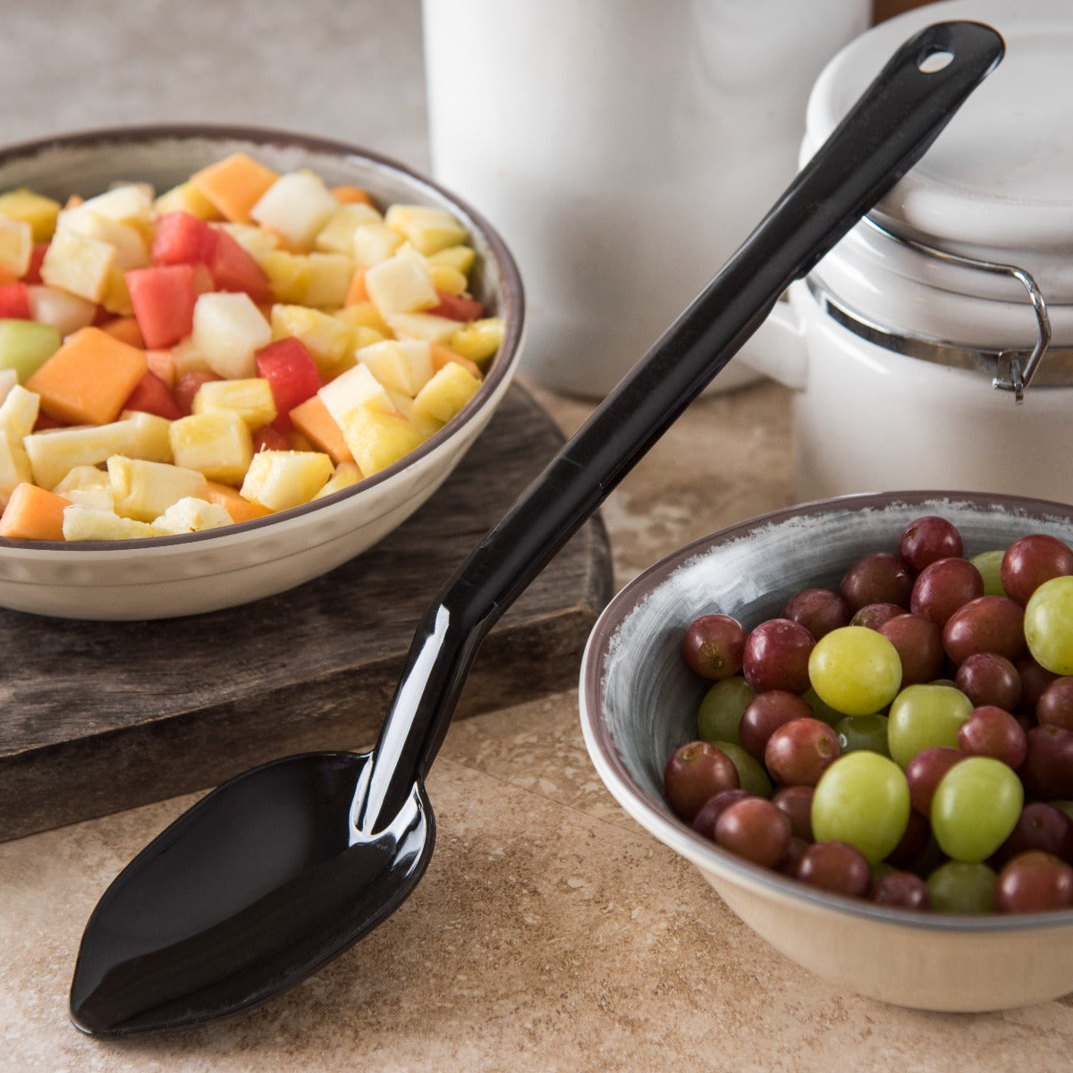 Carlisle 442003 One-Piece Plastic Solid Serving Spoon with Notched Handle 13" - Black