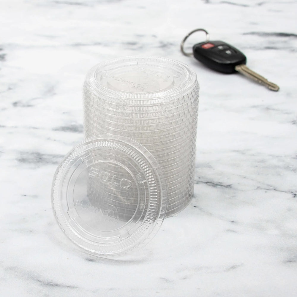 Dart Solo PL200N Medium Ultra Clear Plastic Souffle Cup Lid for 2 oz. Portion Cups - 125/bag